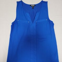 Nwot Royal Blue Sleeveless Blouse Front 100% Polyester Back 100% Rayon Smoke Free Home **Expect Any Non-Tagged Item Of Clothing To Be Laundered In Adherence With The Care Instructions Found On The Item's Tag Prior To Listing Or Shipping. All Non-Tagged Items Ship Clean, Free Of Perfumes, Colognes, Or Other Scents Other Than The Laundry Detergents Used. Blue Tank Vest Blouse, Blue V-neck Tank Top For Work, Sleeveless Blue Blouse For Work, Blue Vest Top For Work, Blue Sleeveless Tank Top For Work, Sleeveless Blouse, Royal Blue, Scents, Care Instructions