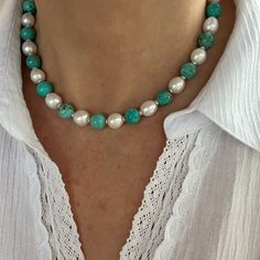 This handcrafted artisan necklace is made with high quality genuine AAA grade 10mm natural Kingman turquoise beads from the Kingman Turquoise mine in Kingman Arizona, 10mm AAA grade baroque oval freshwater pearls exhibiting high luster, and bright high polished sterling silver or gold filled spacer beads. This impressive large statement necklace showcases beads that contrast beautifully with each other and "pop", giving the piece visual interest and character. The turquoise stones are a beautifu Elegant Turquoise Beaded Necklaces With Oval Beads, Elegant Turquoise Beaded Necklace With Oval Beads, Turquoise Round Beads Pearl Necklace With Natural Stones, Handmade Turquoise Pearl Necklace With Round Beads, Turquoise Pearl Necklace With Natural Round Beads, Elegant Turquoise Necklace With Round Natural Stones, Elegant Turquoise Necklace With 8mm Beads, Kingman Arizona, Gemstone Choker