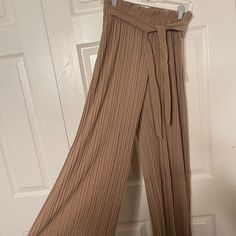 Nude Color Loose Pants. Very Cute With A Belt. Brown Pleated Wide Leg Bottoms, Brown Pleated Wide-leg Bottoms, Beige Pleated Full-length Bottoms, Brown Stretch Pleated Bottoms, Stretch Brown Pleated Bottoms, Elegant Beige Bottoms For Date Night, Chic Stretch Taupe Bottoms, Casual Brown Bottoms For Date Night, Beige Pleated Bottoms For Day Out