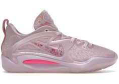 a women's nike basketball shoe in pink and white with floral details on the upper part