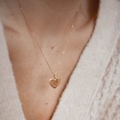 Solid gold heart necklace for those who embrace risks and cherish forever. Choose to purchase the pendant alone or complete the set with the necklace. ✨ Handmade of 14k solid gold (58.3% of gold purity) ✨ Available as a pendant or as a pendant necklace ✨ Waterproof jewelry ✨ Length necklace chain: 46 cm (18.11 inches) ✨ Pendant: height: 11.8 mm (0.46 inches); width: 14 mm (0.55 inches); thickness: 0.9 mm (0.03 inches); weight: 1.8 g (0.06 oz) 🪙 Tips for caring for solid gold Although this gold pendant necklace is a lifetime piece, it's best to protect it from knocks, extreme temperatures, and undue stress.  Solid gold jewelry is waterproof and does not need to be removed before showering or swimming - however, repeated exposure to chlorine in particular will weaken your jewelry's structur Gold Heart Pendant, Heart Hoop Earrings, Solid Gold Necklace, Length Necklace, Heart Pendant Gold, Gold Heart Necklace, Waterproof Jewelry, Chain Extenders, Birthday Gifts For Girlfriend