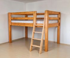 there is a bunk bed and ladder in the room