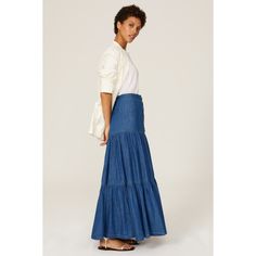 Blue denim (100% Cotton). Maxi skirt. Front button closure. Imported. Medium Wash Denim Tiered Skirt, Flowy Denim Tiered Skirt, Medium Wash Relaxed Long Denim Skirt, Chic Medium Wash Denim Maxi Skirt, Flowy Tiered Denim Skirt, Denim Lined Skirt In Dark Wash, Dark Wash Denim Lined Skirt, Dark Wash Denim Skirt With Lining, Chic Denim Tiered Skirt