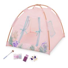 a pink tent with blue straps and decorations on it, next to some stickers