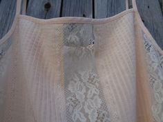 "This is a beautiful spaghetti strap top made of polyester fabric in pale peach color. Complemented with Nylon lace. Brand: St Michael made in the U.K. In excellent condition and comes from smoke-free home. Size M Labelled as size UK 14 (Eur 40; US 10) To fit bust ~36\" / 91cm Thanks for visiting my shop! OLaLaVintage Please visit my other Etsy shop of beautiful handmade items: https://www.etsy.com/shop/MilaStyle" Cream Camisole With Adjustable Straps For Spring, Beige Camisole With Adjustable Spaghetti Straps, Spring Lace Bodice Camisole With Spaghetti Straps, Beige Lace Camisole For Summer, Beige Camisole With Adjustable Straps, Summer Beige Lace Camisole, Cream Camisole With Adjustable Spaghetti Straps, Beige Lace Camisole With Lace Top Detail, Cream Camisole With Built-in Bra And Spaghetti Straps