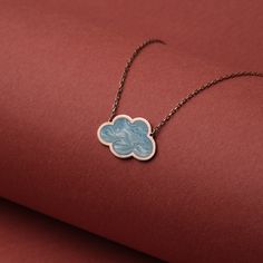 Step into the ethereal beauty of our sky-inspired Blue Enamel Cloud Pendant Necklace. Exquisitely crafted from 14K gold and coated with a mesmerizing blue enamel finish, this piece echoes the tranquil hues of a summer sky. Its minimalist design makes it a perfect accessory for any outfit, subtly accentuating your style with a delicate charm.  🌟 Key Features: 🦋 Handcrafted butterfly pendant exuding unmatched artisanal finesse. ☁️ Authentic blue enamel cloud pendant, a symbol of serenity and calm. 💛 18K solid gold chain and pendant for an opulent touch. 👌 Lightweight, durable, and comfortable to wear daily. 🎁 The perfect gift for her on any special occasion like Birthdays or Christmas. ✨ Beautifully packaged for a luxurious gift-giving experience. Whether you're a minimalist fashion lov Gold Chain And Pendant, Cloud Necklace, Cloud Pendant, Gifts Blue, Chain And Pendant, Christmas Necklace, Gold Chain With Pendant, Necklace Cute, Solid Gold Chains