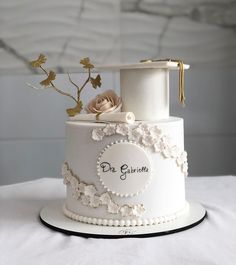 a white wedding cake with flowers on top