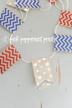 some red, white and blue paper pennants hanging from string