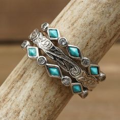 a stack of rings with turquoise stones and silver accents