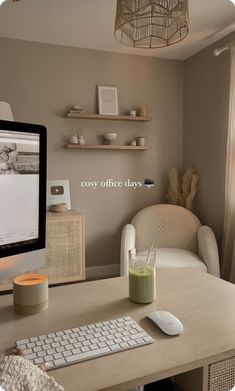 a computer monitor sitting on top of a wooden desk