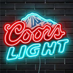 a neon sign that reads coors light on a brick wall with a mountain in the background