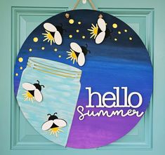 a painted sign with bees and the words hello summer on it in front of a blue door