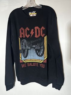 We salute you cannon theme. Licensed graphic fleece crew, super soft inside. Get ready to rock with this AC/DC sweatshirt in classic black color! Made from a cozy blend of polyester and cotton with a soft fleece fabric type, this pullover sweatshirt is machine washable for easy care. Featuring long sleeves with the iconic band's graphic licensed print, this sweatshirt is perfect for men who love rock music. This licensed AC/DC sweatshirt is sized for regular fit and is available in size Medium. Whether you're going to a concert or just running errands, this sweatshirt is a great addition to any rock fan's wardrobe. Ac Dc, Brands Outlet, Rock Music, Fleece Fabric, Pullover Sweatshirt, Classic Black, Black Color, Active Wear, Mens Accessories