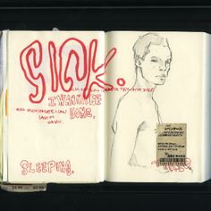 an open notebook with writing on it and a drawing of a man's torso