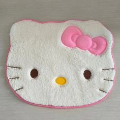 a hello kitty pillow is shown on a table