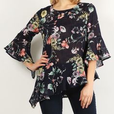 Floral Print Tunic Top In Deep Navy Color. The Asymmetrical Hem And Ruffle Has A Slimming Effect. The Bell Sleeves Are Full For A Comfortable Fit. 100% Pre-Shrunk Cotton Machine Wash Made In Usa Flowy Floral Print Tunic Cover-up, Printed V-neck Tunic, Black V-neck Bohemian Tunic, Bohemian V-neck Tunic With Floral Print, Multicolor Floral Print Peasant Top With V-neck, Coral Blouse, White Short Sleeve Blouse, Floral Print Tunic, Blue Floral Blouse