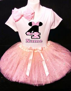 a pink tutu skirt and t - shirt with minnie mouse on it