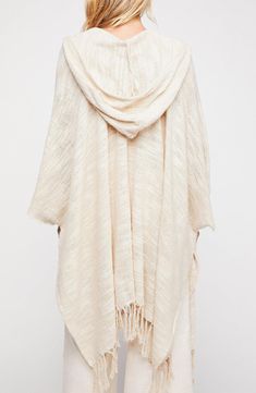 The only thing better than a Saachi ruana? A Saachi ruana with a hood! Our Dawn to Dusk Hooded Ruana Wrap is soft and cozy and will take you through all seasons. 27" length; 6.5" fringe (one size) Open front Kimono sleeves Knitted construction 100% cotton Hand wash cold, line dry Imported Hooded Kimono, Poncho Outfit, Free People Kimono, Ruana Wrap, Boho Poncho, Open Front Kimono, Fringe Kimono, Kimono Sweater, Boho Hippie Chic