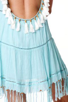 "Pretty low back dress in refreshing Santorini blue. Adjustable ties with tassels at shoulders. Tassels and beads details in the back and at the bottom trims. Available in S, M and L Size S: Width 17\" lay flat ** In stock. Ship immediately via USPS First Class Mail from Las Vegas (2-3 business days, not including one day handling time)." Sleeveless Beaded Fringe Mini Dress For Summer, Blue Backless Beach Dress Cover-up, Light Blue Tie Back Mini Dress For Beach, Summer Backless Dress With Fringe, Blue Tie-back Dress For Beach Cover-up, Blue Tie-back Dress For Beach, Blue Tie Back Dress For Beach Cover-up, Blue Tie Back Dress For Beach, Turquoise Bohemian Mini Dress For Summer