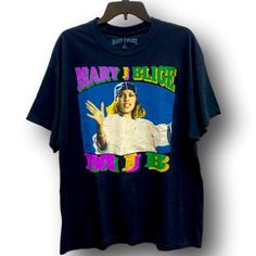 Graphic T-Shirt. Mary J. Blige Design With "Mary J Blige" & "Mjb" Text. Size Extra Large Xl (Unisex). Mary J Blige & Spencer's Gifts Brand. Black Colored Shirt With Purple, Yellow, Green, Blue, Brown, White & Black Colors Design. 100% Cotton. Brand New With Tags Attached. Perfect For Any Fan Of Mary J. Blige, The "Queen Of Hip Hop Soul" With Singles Such As "Real Love', "Family Affair", "You Remind Me", "I'm Goin' Down", "Be Without You", & Many More! Mary J Blige, Spencers Gifts, Mary J, Family Affair, Without You, Blue Brown, Graphic T Shirt, White Black, Extra Large