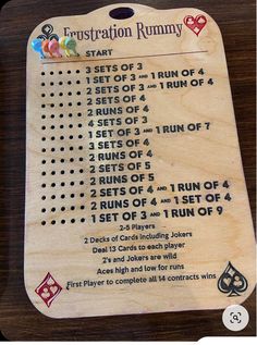 a wooden board with instructions for how to play the rummy card game on it