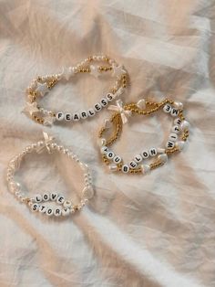 #taylorswift #friendshipbracelet Fearless Era Bracelet, Aesthetic Friendship Bracelets Beads, Eras Tour Bracelets Fearless, Debut Bracelet Ideas, Concert Bracelet Ideas, You Belong With Me Bracelet, Taylor Swift Friendship Bracelet Aesthetic, Debut Friendship Bracelet Ideas, Fearless Friendship Bracelet Ideas