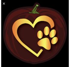 a heart shaped pumpkin with a paw print on the front, and an image of a dog's paw in the center