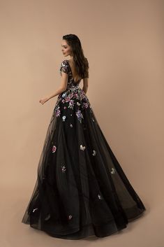 Embrace the allure of our "Gothic Black Floral Tulle Wedding Dress - Appliqué Embroidered Evening Gown Plus Size," where dark elegance meets blooming romance. This dress is a celebration of gothic beauty, featuring lush floral appliqués that cascade over layers of sumptuous black tulle. Each embroidered bloom is a testament to craftsmanship, adding a vibrant burst of color that stands out against the night-inspired fabric. The gown's silhouette, designed with an A-line cut, promises to flatter a Dark Floral Wedding, Prom Gown Elegant, Evening Gown Plus Size, Nontraditional Wedding Dress, Purple Wedding Dress, Dark Elegance, Dark Fabric, Gown Plus Size, Applique Wedding Dress