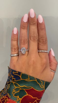 A gorgeous 1.6 mm diamond band makes this ring delicate, feminine and everything a woman wants. Her platinum setting holds a brilliant oval diamond. Interested in seeing wedding band pairings? Check out some options here. Drop-down diamond options represent our recommended grade, which maximizes size for value, while maintaining eye-perfect clarity and giving you a colorless look. For other diamond options, see our Shop Diamonds tab or speak to one of our design consultants. This design can also be made with other stone shapes. Setting only cost below: 14k Rose, White, or Yellow Gold setting $1895 18k Rose, White, or Yellow Gold setting $2195 Platinum setting $2395 Oval Style Engagement Rings, White Sapphire Ring Engagement, Gold Oval Diamond Engagement Ring, 4ct Oval Engagement Ring, Engagement Ring Timeless, Timeless Oval Ring With Diamond Accents, 1 5 Carat Oval Engagement Ring Platinum, Trilogy Ring With Wedding Band, Oval Diamond Cut Platinum Wedding Ring