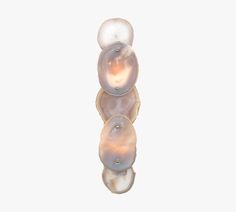 three pearls are stacked on top of each other in the shape of an object,