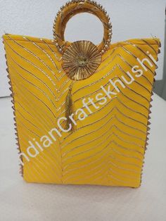 a yellow handbag sitting on top of a white table