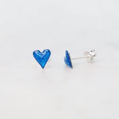 Perfect Post Earrings for Stacking, and Everyday Wearing. Model photo shows a different color; for size reference only! Sterling silver, enamel 7.2mm x 6.6mm Handmade in Thailand Handpicked in Person by our Buyers Blue Pierced Heart Earrings, Blue Nickel-free Sterling Silver Heart Earrings, Blue Sterling Silver Nickel-free Heart Earrings, Nickel-free Blue Heart Earrings As Gift, Blue Nickel-free Heart Earrings As Gift, Nickel-free Blue Heart Earrings For Gift, Blue Heart Earrings Nickel Free For Gift, Blue Pierced Heart Earrings For Gift, Blue Pierced Heart Earrings As Gift