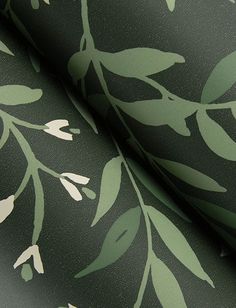 a green and white wallpaper with leaves on it