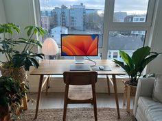 a living room filled with furniture and a large window