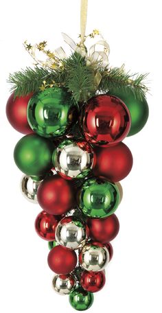 an ornament hanging from a tree filled with christmas balls and baubles