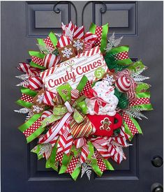 a christmas wreath with candy canes on it