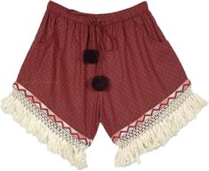 A pair of bohemian cotton shorts with crochet lace and fringes on the hemline and drawstring with pompoms - these pair of shorts have pockets on both sides. The shorts have an elastic waistband along with a functional drawstring. #tlb #Lace #Fringe #Pocket #vacationclothing #beachwrap #bohemianfashion #JuniorPetite #BohemianShorts #VacationShorts #shortswithfringes #shortswithpompoms Summer Festival Bottoms With Tassels, Bohemian Vacation Shorts, Cotton Bottoms With Tassels For Vacation, Bohemian Bottoms With Crochet Trim For Summer, Hippie Fringe Bottoms For Summer, Bohemian Summer Bottoms With Crochet Trim, Bohemian Style Shorts With Crochet Trim For Summer, Bohemian Shorts With Crochet Trim For Vacation, Bohemian Vacation Bottoms With Crochet Trim