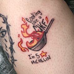 a woman's thigh with a tattoo saying cooking like mike i'm 5 michel