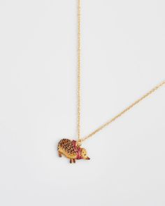 Wrap yourself in the cosy embrace of our Hedgehog Charm Necklace. This adorable necklace features a hand-painted enamel hedgehog snug in a tiny scarf. A symbol of resilience and exploration, this piece is perfect for those who cherish nature’s small wonders and the comforting beauty of autumn evenings.

Key Features:



Hand-Painted Hedgehog Charm: Adorned with a tiny scarf, this charm captures the cozy and resilient spirit of autumn.


Elegant Gold-Plated Brass Chain: The 18ct high polish gold Tiny Scarf, Swan Jewelry, Mushroom Jewelry, Talisman Necklace, Green Tote, Cotton Pouch, Animal Brooch, Gifts For Colleagues, Pocket Mirror