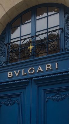 a blue door with the name bvlgari written in gold on it