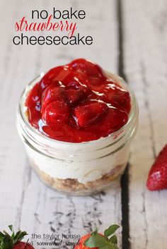 no bake strawberry cheesecake in a jar with strawberries