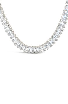 Baguette-cut cubic zirconia bring glamorous sparkle to an elegant frontal necklace finished in gleaming silvertone or 14-karat gold plate. 16" length; 2" extender Lobster clasp closure Silvertone or 14k-gold plated brass/cubic zirconia Imported Silver Cubic Zirconia Tennis Necklace For Party, Silver Tennis Necklace With Baguette Diamonds, Glamorous Silver Jewelry With Baguette Diamonds, Silver Cubic Zirconia Baguette Cut Necklace, Baguette Cut, Lobster Clasp, Cubic Zirconia, Silver Tone, Gold Plate