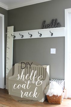 a white shelf sitting next to a ruler on top of a wooden floor with the words diy shelf coat rack all american trade work