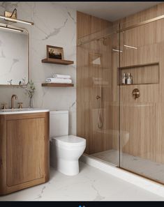 a bathroom with a toilet, sink and shower stall in the middle of the room