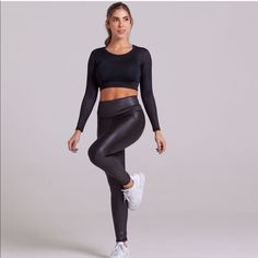 a woman in black sports bra top and leggings