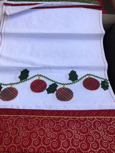 the table cloth is decorated with red and green ornaments