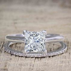 an engagement ring with a princess cut diamond