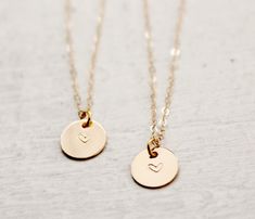 "Best friends Necklace Set, Mom and Daughter necklace set, friendship necklace This lovely set of 2 necklaces features tiny 14k Gold filled discs, (slightly over 3/8\"), hand stamped with a heart. Beautiful lightly brushed finish. Each one hangs from a 16\" or 18\" 14k Gold filled chain. Keep one for yourself and give the other to a loved one. :) Click here to see this set in Sterling Silver: https://www.etsy.com/listing/177999973/sterling-silver-best-friends-necklace?ref=shop_home_active_1" Dainty Friendship Necklaces For Valentine's Day, Dainty Heart Pendant Charm Necklace For Best Friend, Dainty Heart Pendant Necklace For Best Friend, Dainty Friendship Necklace For Valentine's Day, Friendship Dainty Necklace For Valentine's Day, Personalized Dainty Necklace For Friendship, Dainty Personalized Necklace For Friendship, Dainty Personalized Friendship Necklace, Dainty Heart Necklace For Friendship