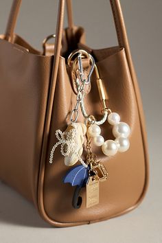 Find ANTHROPOLOGIE Rope Caraber Bag Charm on Editorialist. Charming new-trend alert: jewelry for your bag, featuring a thread-wrapped carabiner and pearl-decorated chain. Rope Carabiner Bag Charm in Black, Women's, Polyester/Brass/Resin Mini Bag Design, Bags With Keychain, Bag Charms Aesthetic 2024, Purse Keychain Aesthetic, Aesthetic Bag Charms, Purse With Charms, Purse Charms Aesthetic, Purse Accessories Ideas, Diy Bag Charm Ideas