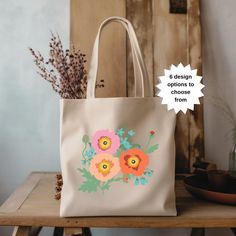 Floral designs printed on a tote bag - makes a great personal accessory or gift! Pretty, detailed design, and feminine style. Original art by Liz Dube. This is a hand drawn image printed on a bag. - 100% durable cotton canvas, natural color - Heavy fabric (12 oz/yd² (406.9 g/m - Size: 15" x 16" - 20" handles (made from the same canvas) - 6 Design Options to choose from: Purple Yellow, Red Pink Heart, Spring Tulip, Pink Peach Coral, Poppy, Lemon This item is for your personal use and not for resale or to be used in creating your own commercial item. DISCLAIMER: I've done my best to represent this art print but colors can vary from screen to screen and printer to printer. Copyright @ 2024 The Merry Meadow Eco-friendly Floral Canvas Bag For Everyday Use, Botanical Canvas Bags For Everyday Use, Botanical Style Canvas Bags For Everyday Use, Botanical Style Canvas Tote Bag For Daily Use, Floral Print Canvas Tote Bag As Gift, Floral Print Canvas Tote Bag For Gift, Rectangular Canvas Bag With Floral Print As Gift, Rectangular Canvas Bag With Floral Print For Gifts, Everyday Floral Print Canvas Bag